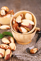 Tasty brasil nuts on wooden background