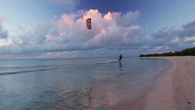 kite surfing at sunset. fun in the ocean, extreme sport