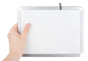 Hand holding an empty whiteboard (magnetic board) isolated