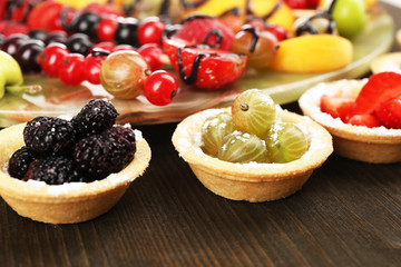 Fresh berries dessert for healthy snack on wooden table close