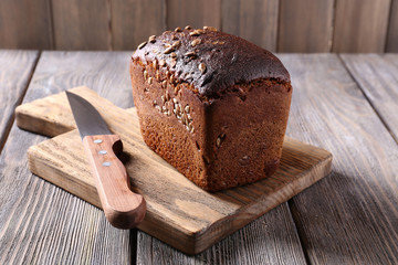 Fresh bread on wooden table, close up