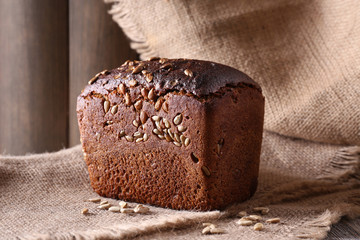 Fresh bread on wooden table, close up