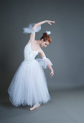 Fototapeta na wymiar ballerina on a grey background