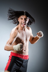 Ripped martial arts expert at training