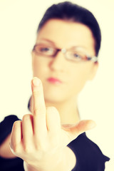 Young woman with middle finger up