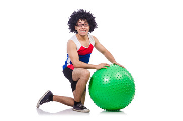 Man with swiss ball doing exercises on white
