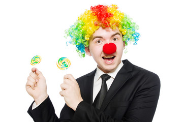Clown with lollipop isolated on white