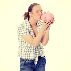 Woman Holding Piggy Bank