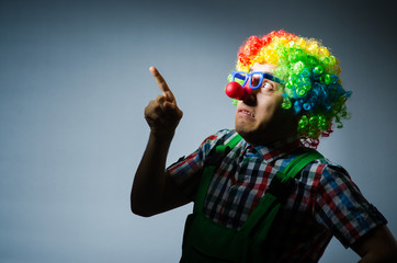 Funny clown against the dark background