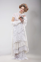 Finery. Glamorous Lady in Elegant Lacy Dress