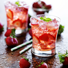 strawberry cocktail drink with ice and mint