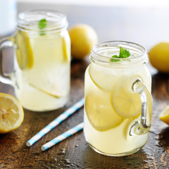 lemonade in jar with ice and mint - obrazy, fototapety, plakaty