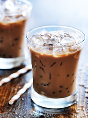 two glasses of iced coffee shot with selective foc us