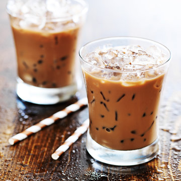 two glasses of iced coffee shot with selective foc us