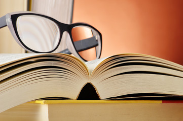 Composition with glasses and books on the table