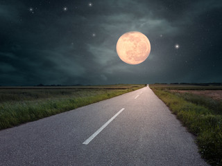Driving on an empty road towards the moon © rasica