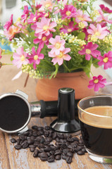 Hot coffee and coffee making equipment with flower clay pot.