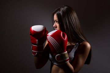 Beautiful woman with the boxing gloves