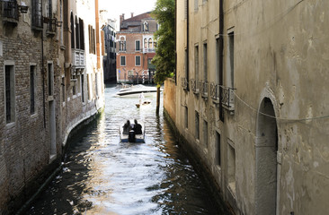 Man on a boat in Venice