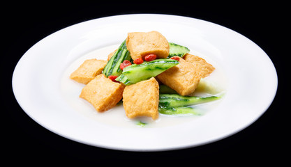 Luffa boiled tofu, Chinese traditional cuisine isolated on black