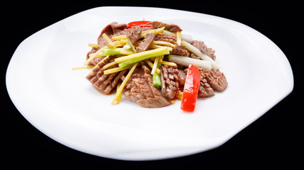 Colourful meat and vegetable stir-fry being cooked