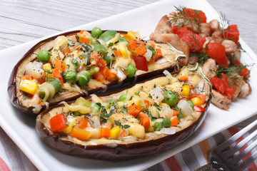 Half baked eggplants stuffed with vegetables