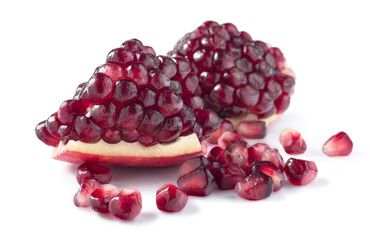 Big fresh piece of pomegranate isolated on white background