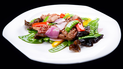 The mushroom fry meat  isolated on black, chinese cuisine