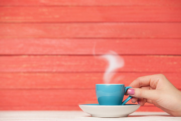 Fototapeta na wymiar Tea or coffee cup on wooden table.