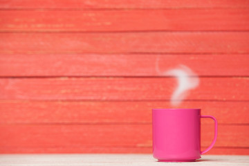 Obraz na płótnie Canvas Tea or coffee cup on wooden table.