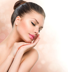 Beauty Spa Woman Portrait. Beautiful Girl Touching her Face