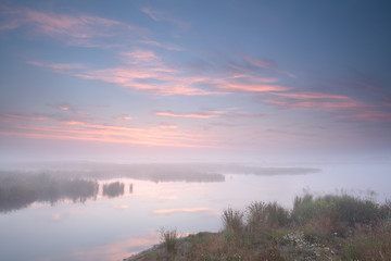 Fototapeta premium misty sunrise over river