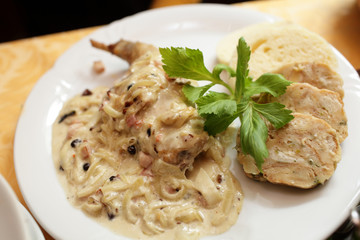 Fish with bechamel sauce onions