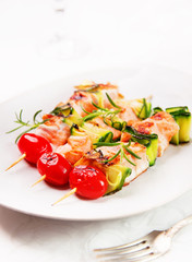 salmon skewers with cherry tomatoes and zucchini