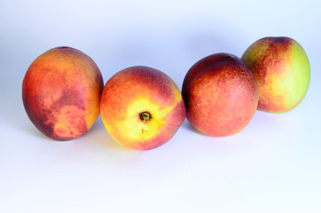 Peaches on a white background