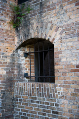Brick wall with metal bars
