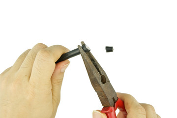 Man use old pliers to pinch cable line for repair isolated
