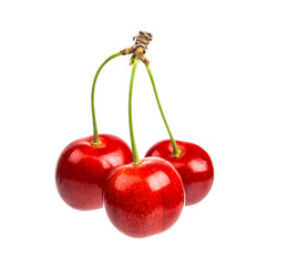 Three sweet cherries isolated on a white background