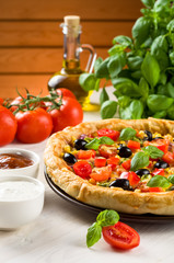 Pizza on wooden table