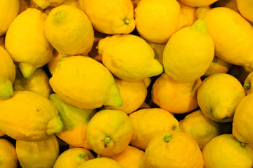 food background. closeup on tropical fruits lemons.
