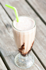 Protein snack. Ice-cream milkshake with chocolate. Outdoors