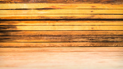 Naklejka premium Wooden planks texture with natural timber grain, featuring warm brown hues and rustic weathered surface details, perfect as a decorative background for carpentry or construction design
