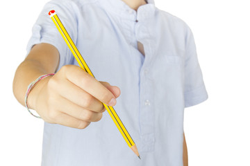 Child showing a pencil