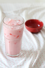 glass of strawberry flavored milk