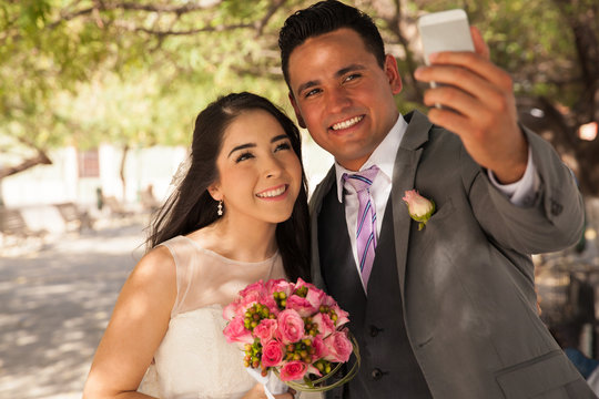 Bride and groom taking selfie