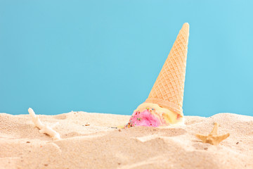 Studio shot of an ice cream splashed on sand