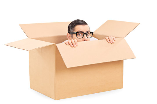 Scared Man Hiding In A Carton Box