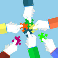 Businessman assembling jigsaw puzzle