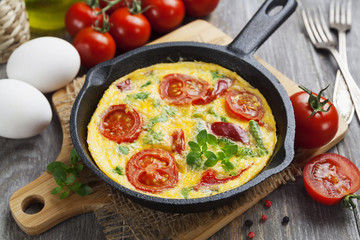 Omelet with vegetables and cheese. Frittata