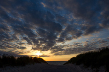 Fototapeta na wymiar sundown at the shoreline in holland